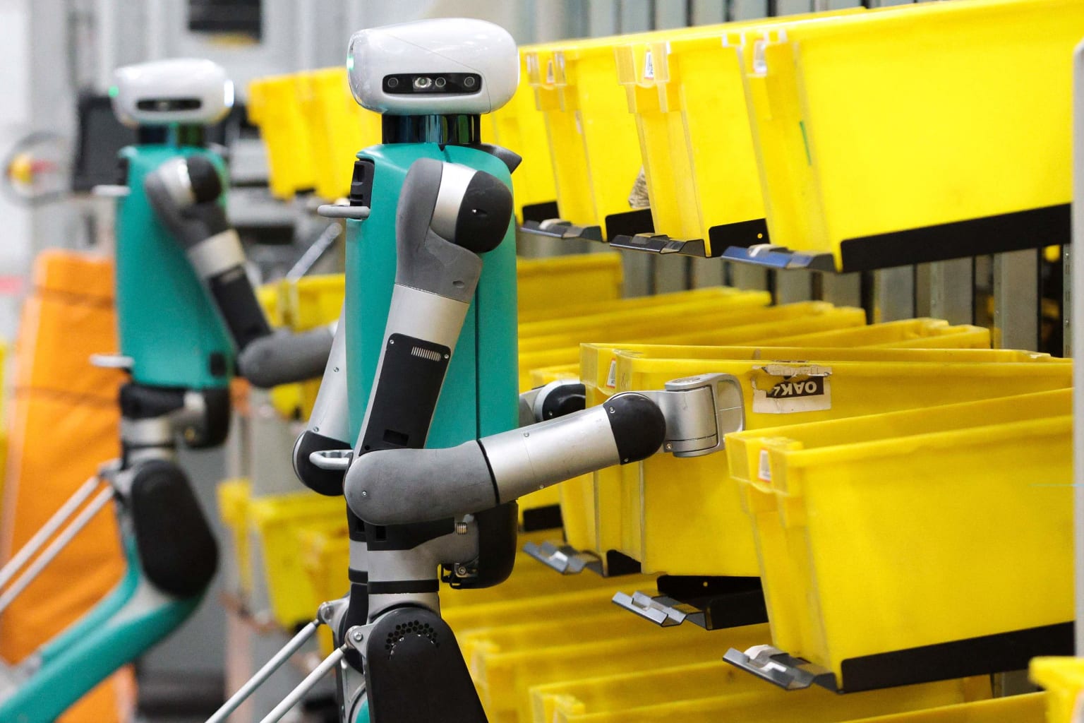 Amazon robots organizing bins.
