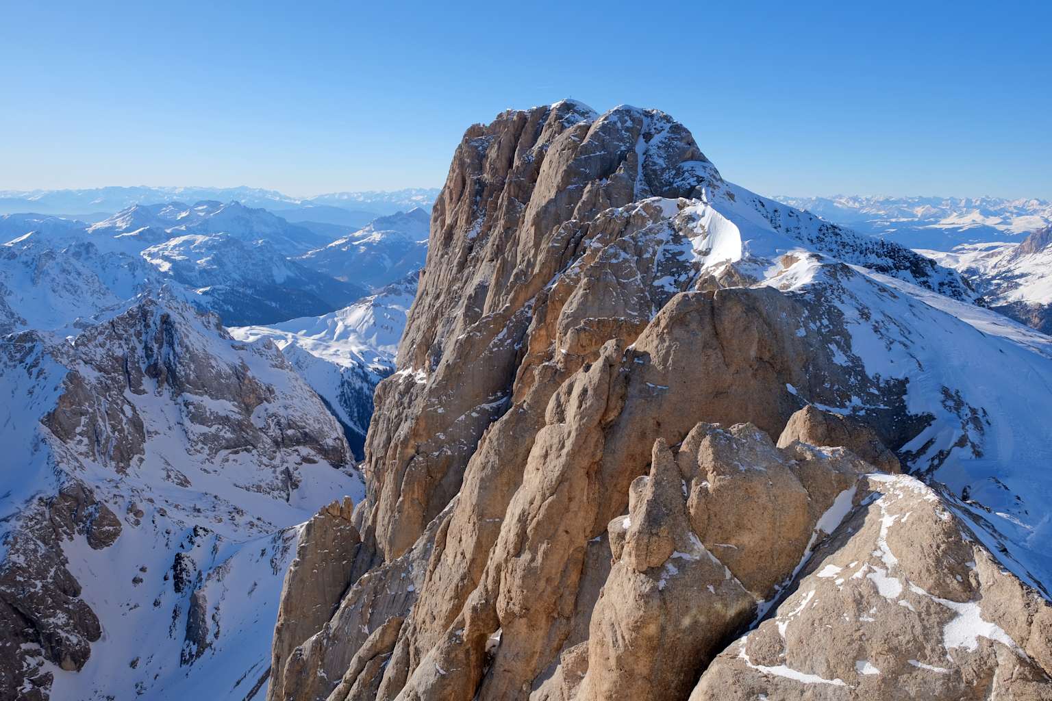 Punta Penia (3,343 m), the highest point of Marmolada mountain in the Dolomites, partially covered in snow.