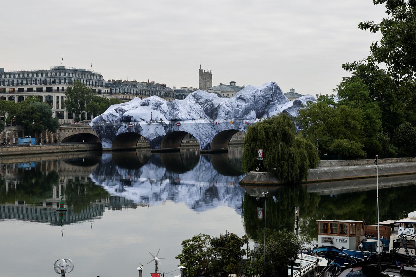 JR begins building giant inflatable cave over Paris's Pont Neuf