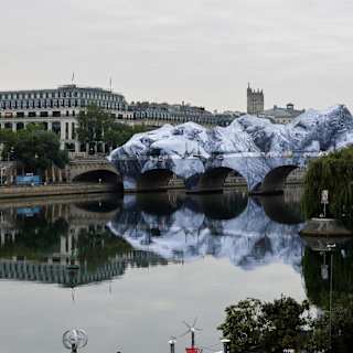 JR begins building giant inflatable cave over Paris’s Pont Neuf