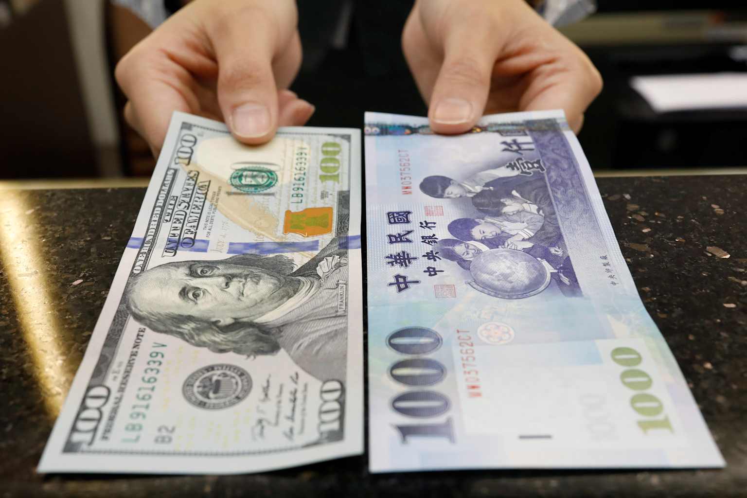 Taiwan dollar's record rally is a trade-war tremor | Reuters
