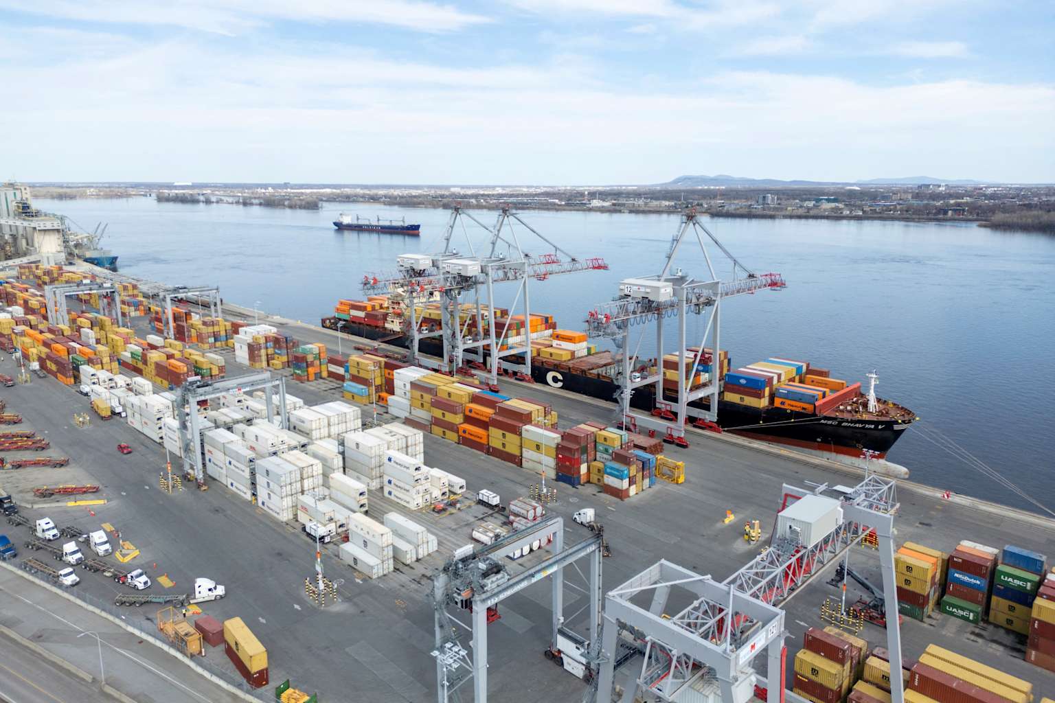 Canada's trade deficit in May narrows, exports to the U.S. ...