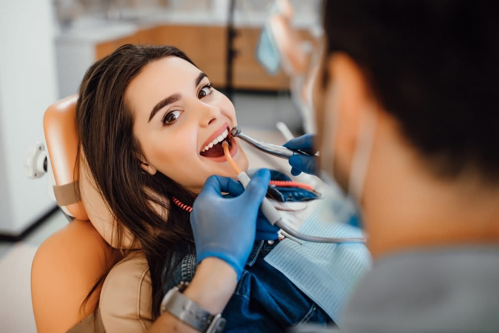 Orthodontist examining a patient during a diagnostic consultation appointment
