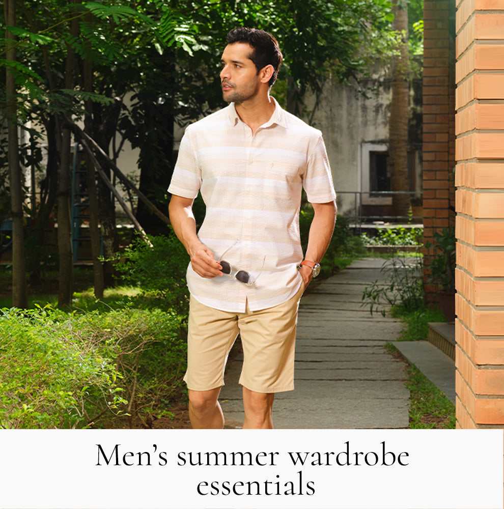 Men elevated airport look India — minimal tee front-tucked with relaxed trousers and loafers