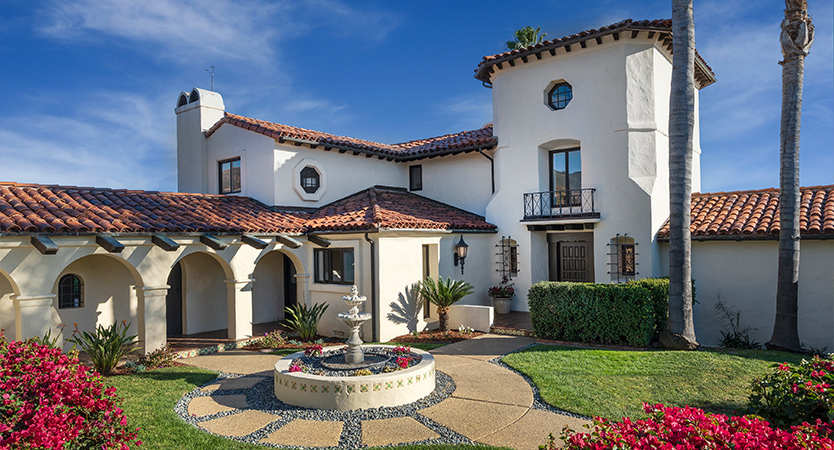 Spanish-style Santa Barbara home exterior with landscaped front yard