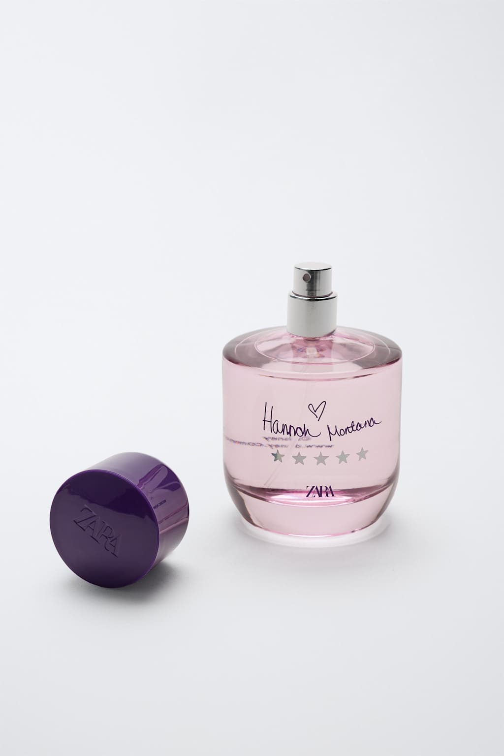 Frasco rosa e tampa roxa do perfume Hannah Montana Disney lançado pela Zara