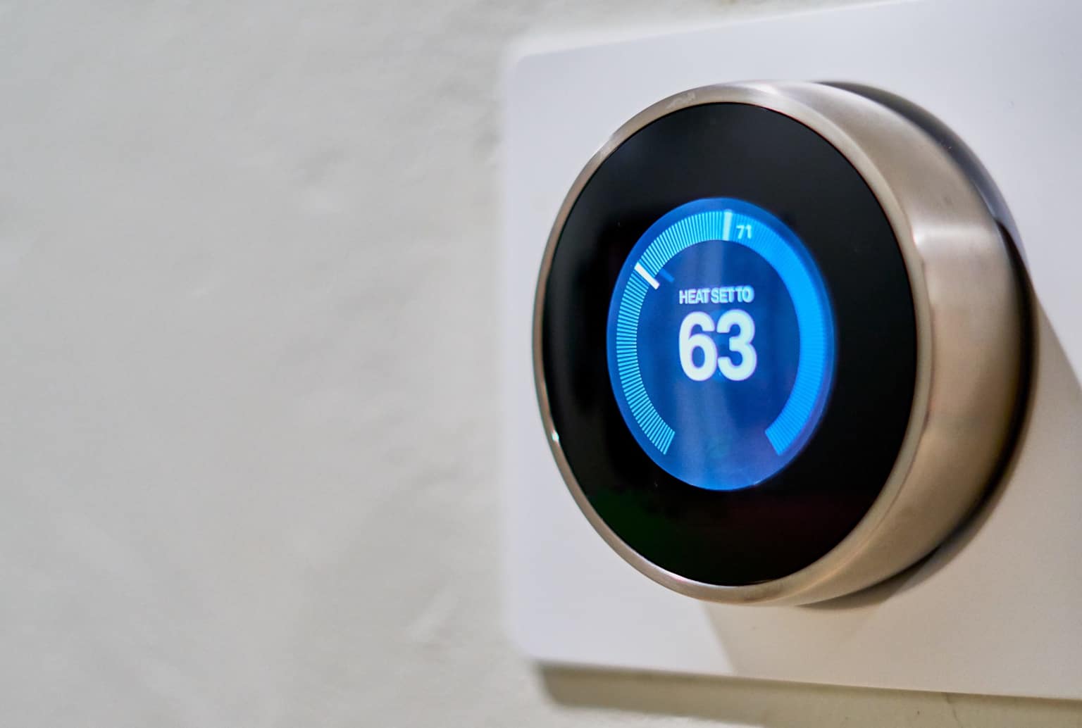 A smart thermostat programmed to a lower temperature to save energy daily