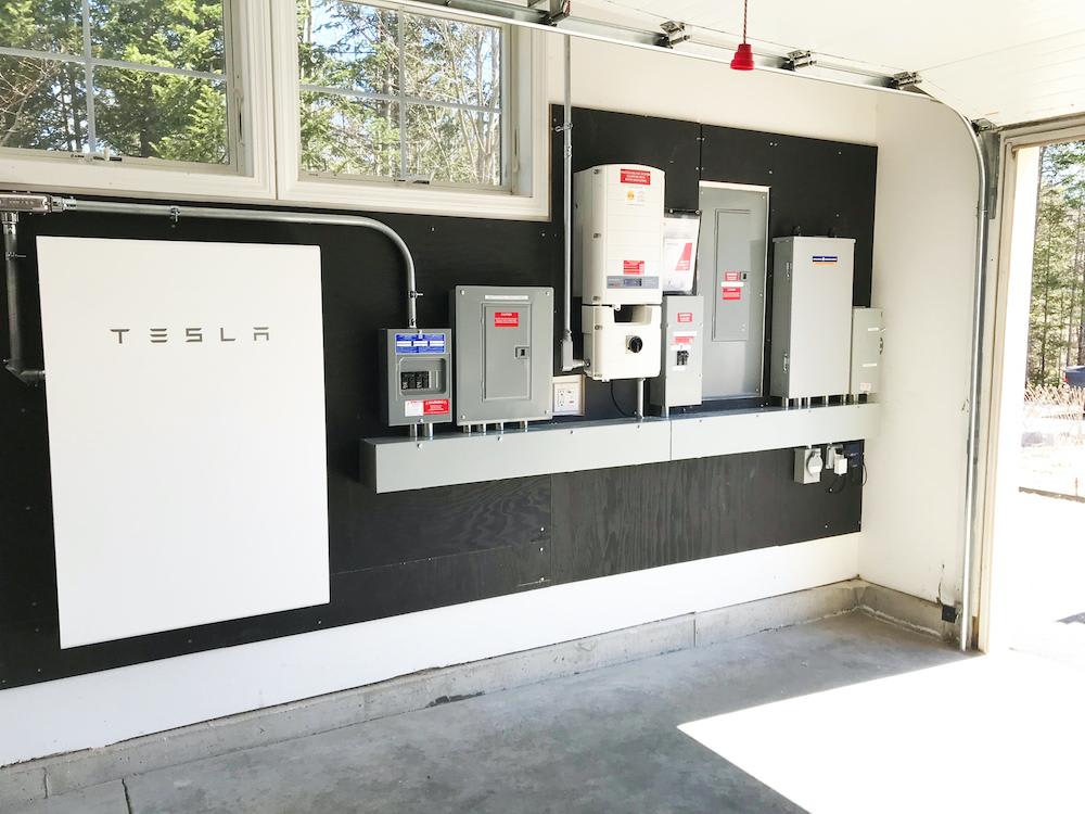 Tesla Powerwall battery units mounted on garage wall