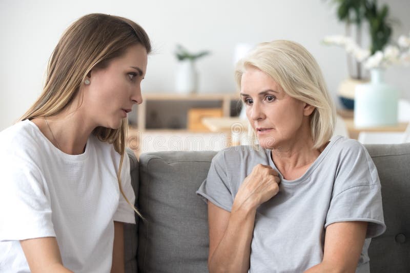 Mother and daughter having a conversation at home