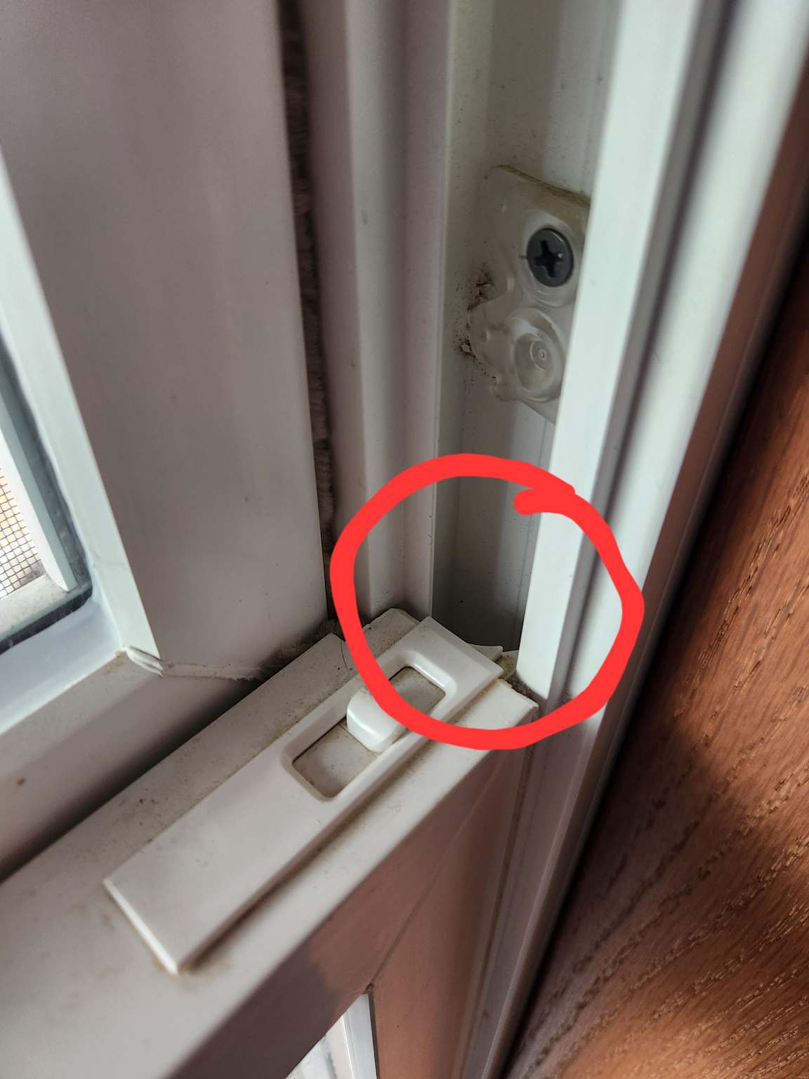 DIY weatherstripping applied to a drafty window frame to save energy