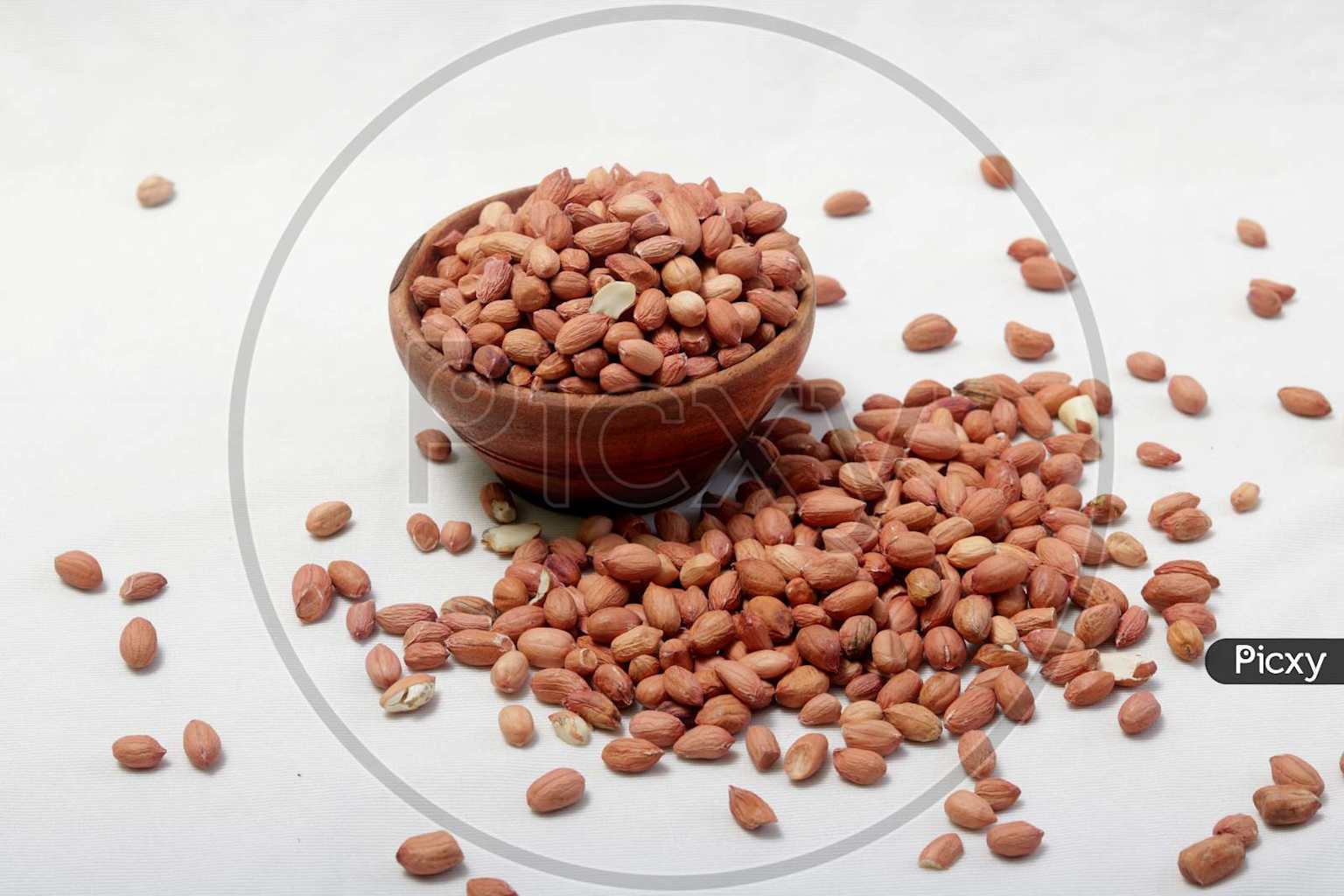 Raw peanuts in an earthen bowl