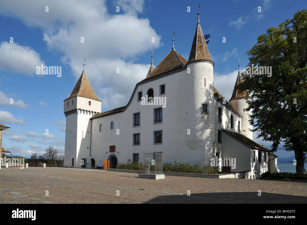 Chateau de Nyon white towers brown roofs Lake Geneva