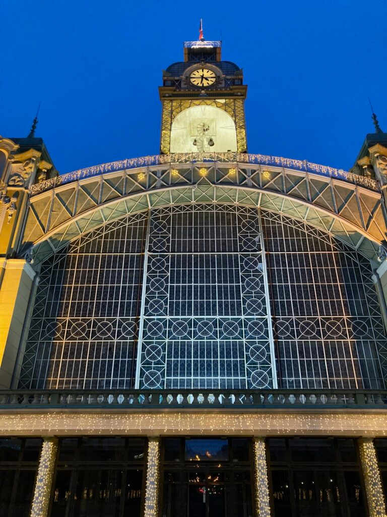 Industrial Palace clock tower dark blue night sky