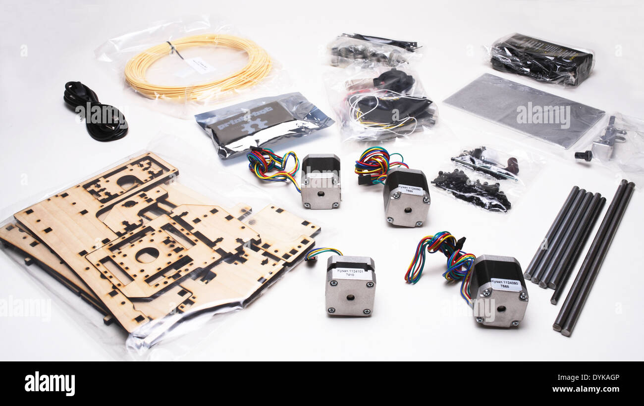Assorted 3D printer components laid out on a table