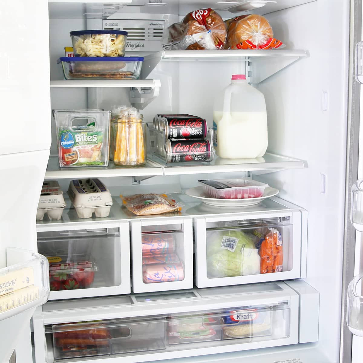 A perfectly organized refrigerator showing different storage zones