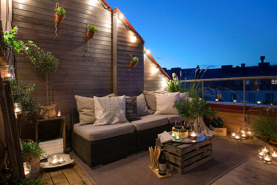 Cozy apartment terrace lit up at night showcasing reliable outdoor lighting