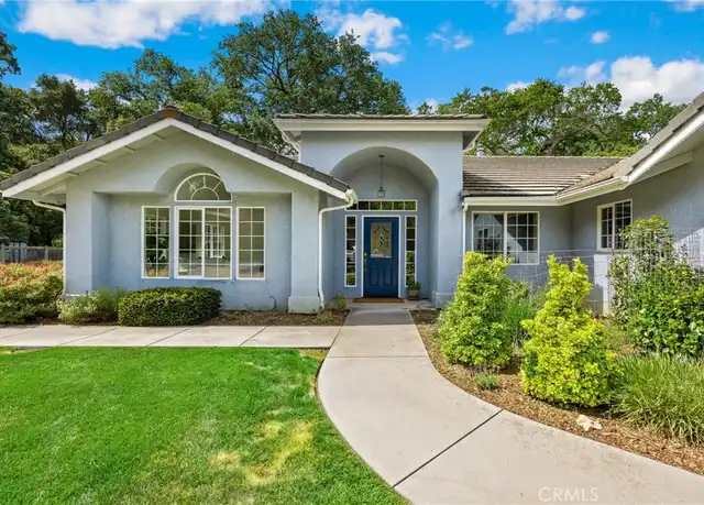 Single-story home with front lawn and walkway
