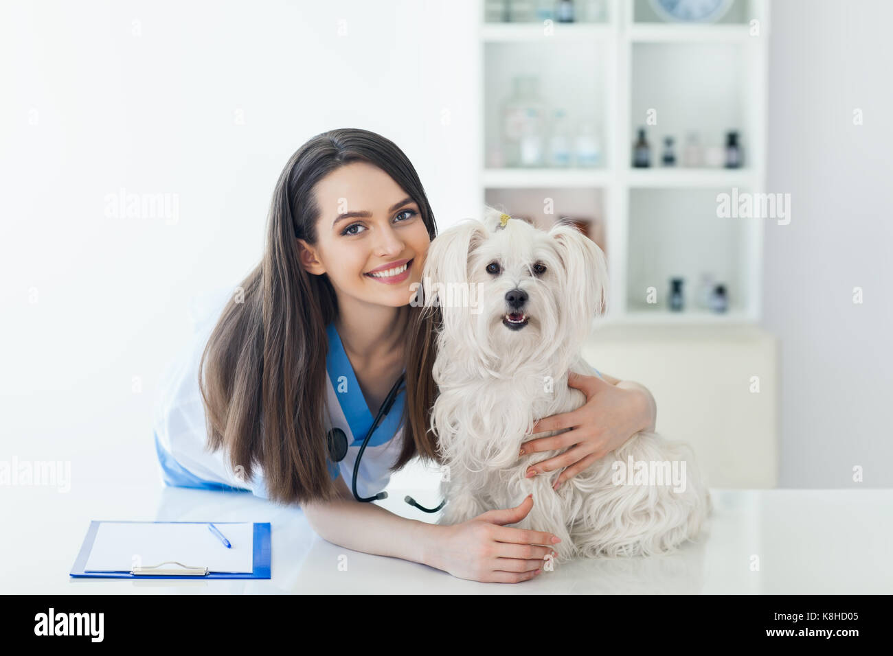 Our veterinarian with a happy dog patient