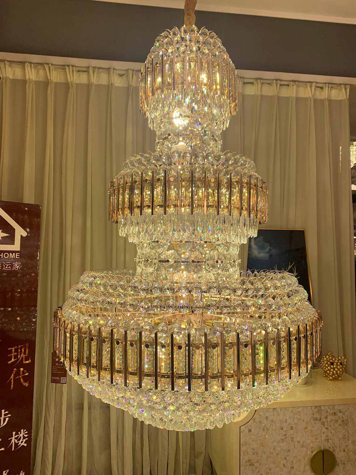 Multi-tiered crystal chandelier in luxury hotel lobby