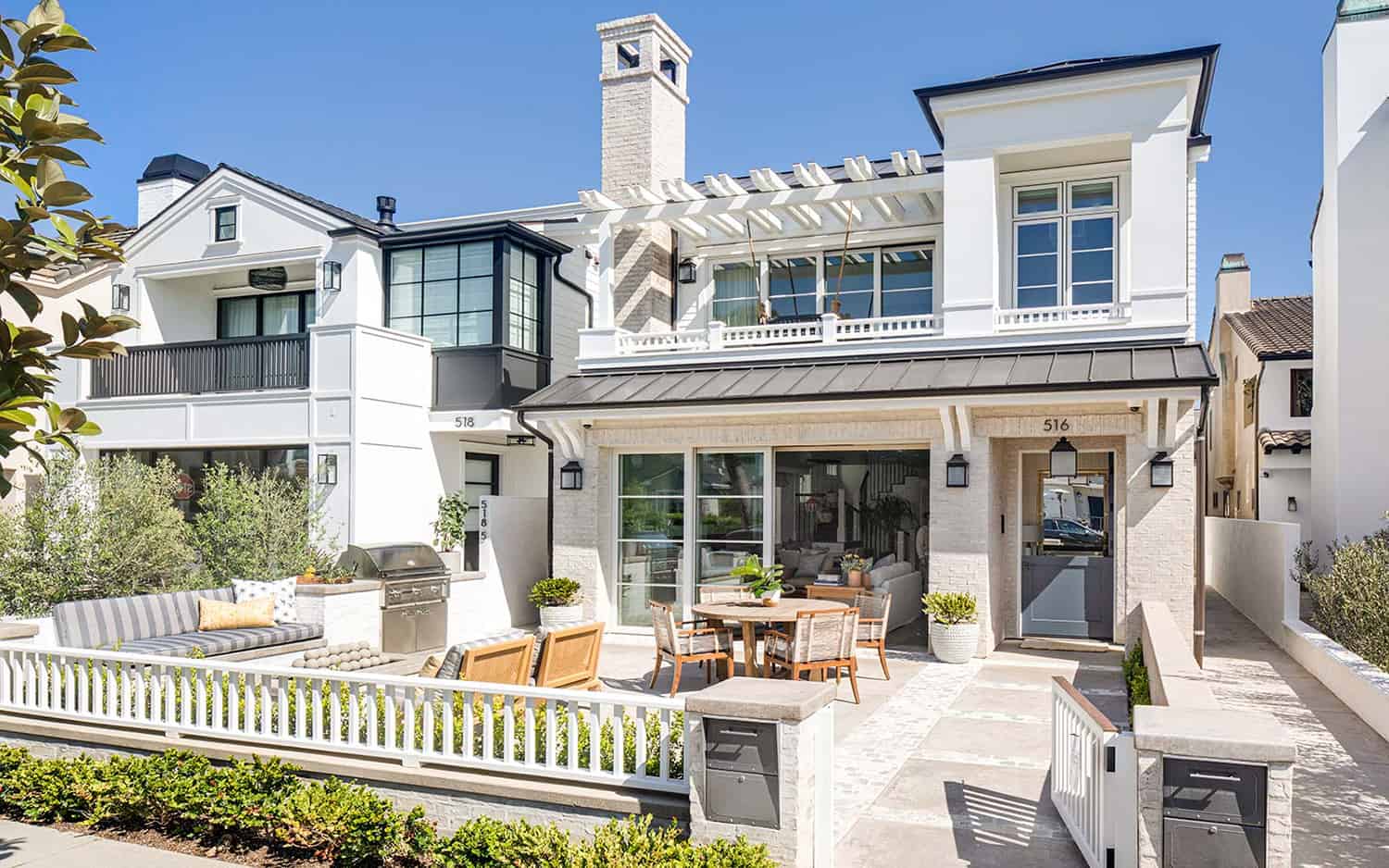 Outdoor coastal home patio with indoor outdoor living