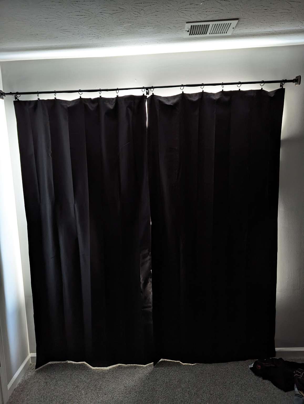 Example of overlapping curtains pulled tightly closed to block drafts