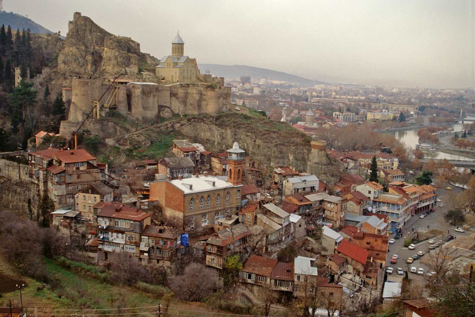 Tbilisi historic district with red-roofed buildings and Narikala Fortress — Georgia