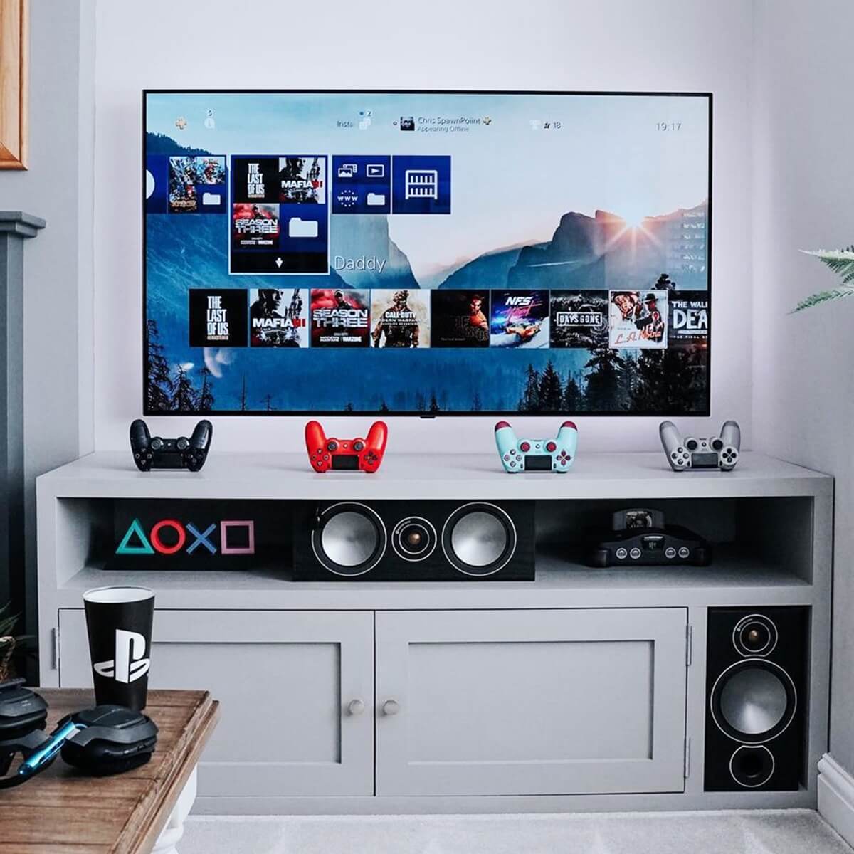 Entertainment center with TV and consoles, perfect for a smart power strip