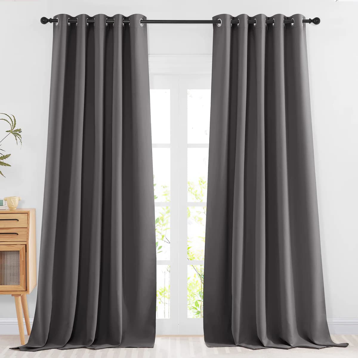 NICETOWN full blackout curtains dark grey hanging in bedroom over window