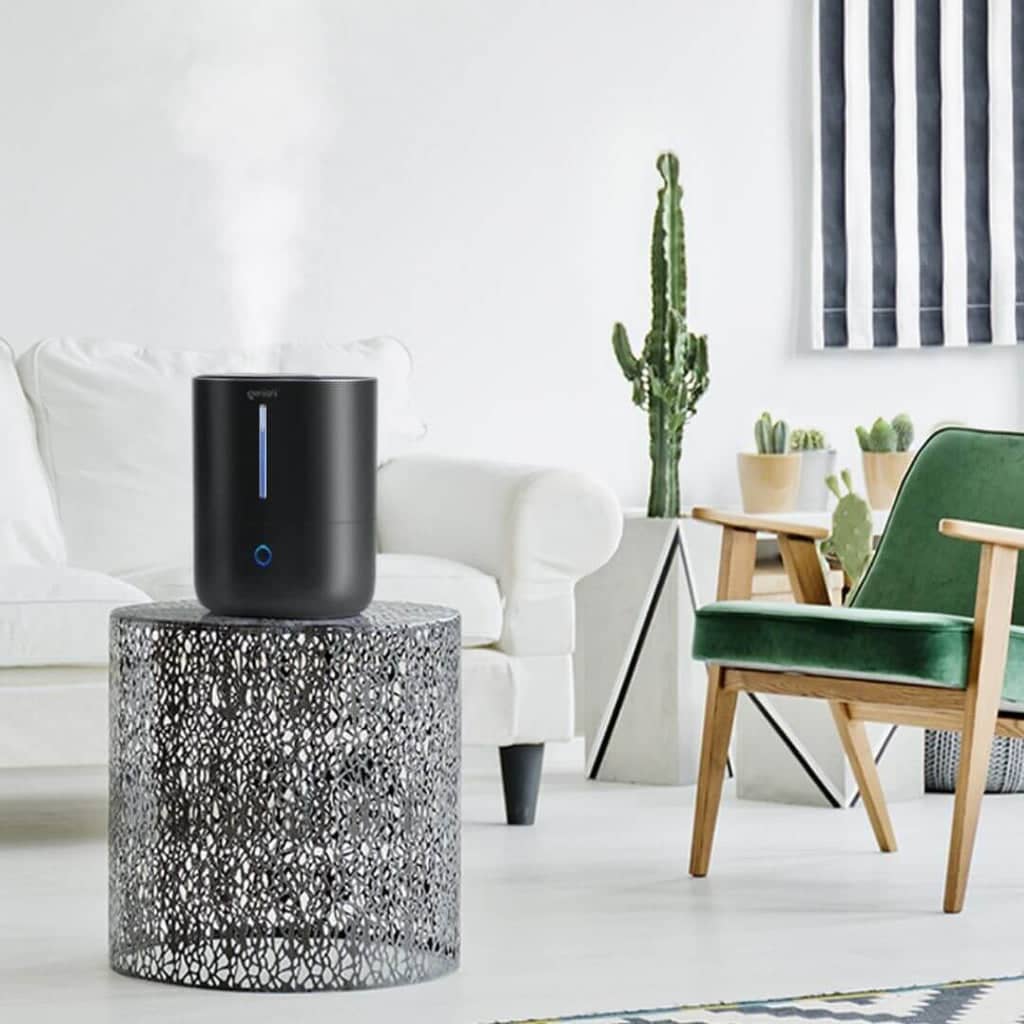 A modern humidifier adding moisture to a dry winter room to increase perceived warmth