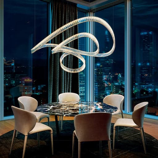 Ring crystal chandelier over marble dining table in luxury restaurant