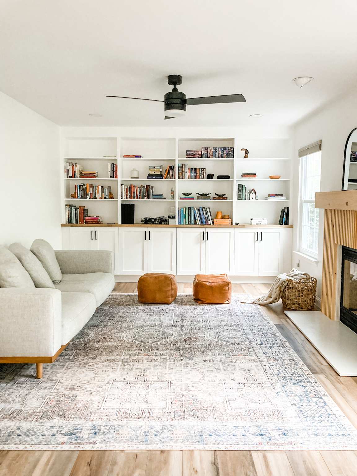 Custom floor-to-ceiling built-in bookshelves in Tampa Bay living room