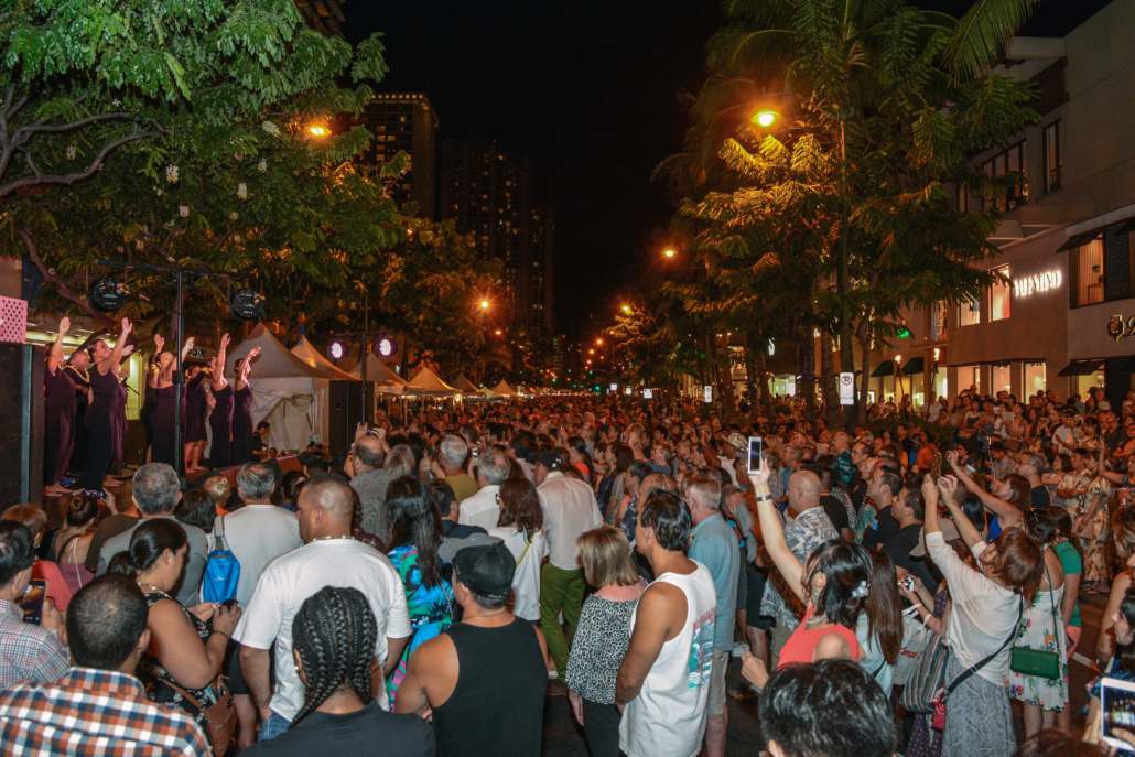 Waikiki Aloha Festivals block party at night with crowd and stage