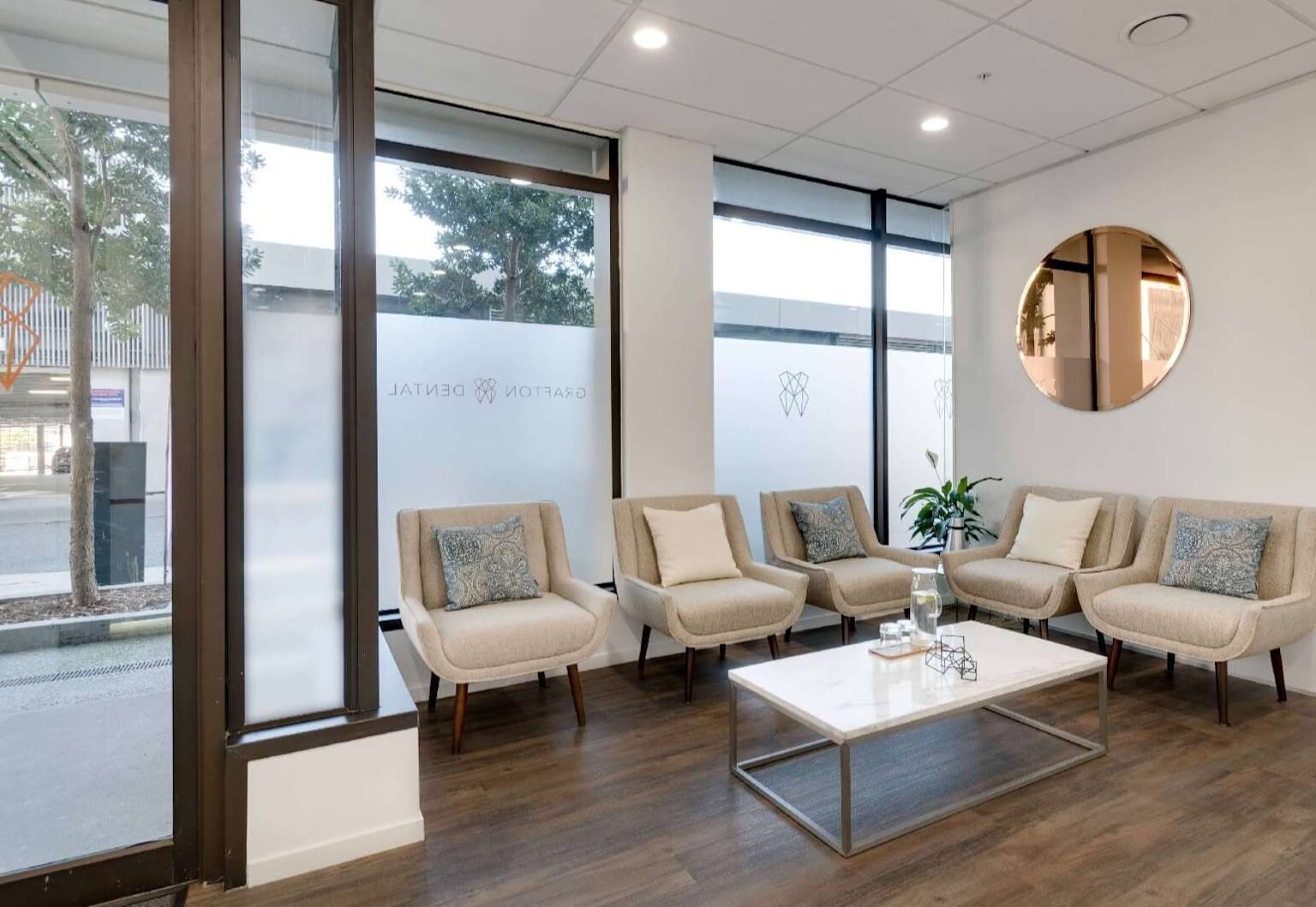 Warm dental waiting room with comfortable seating and natural light
