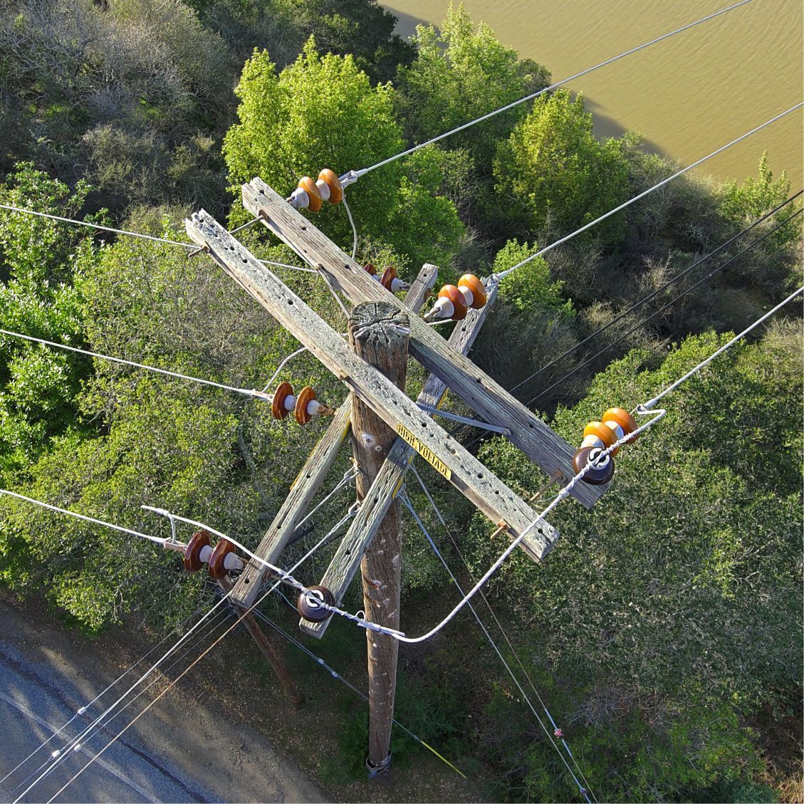 Drone aerial view of utility pole with power lines