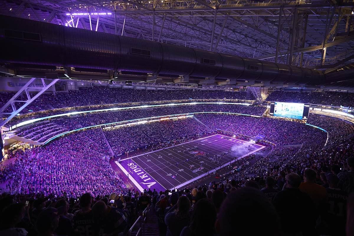 Stadium lit up at night with full crowd