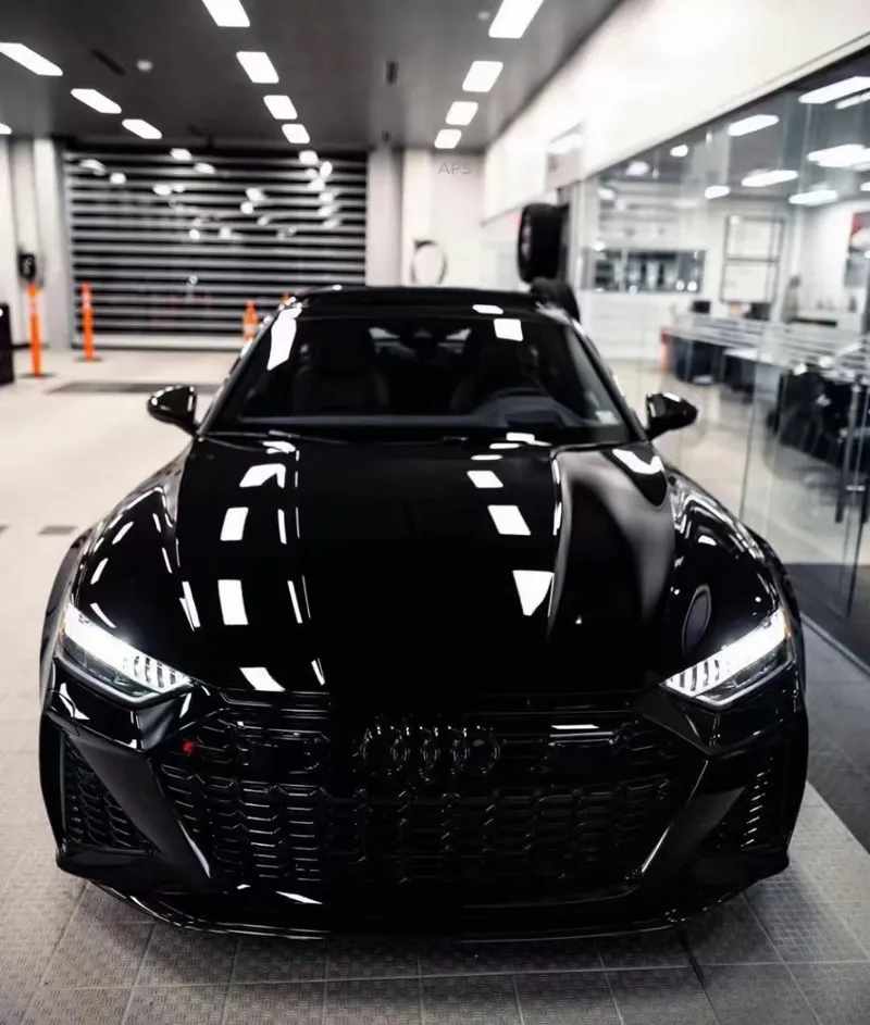 Glossy black luxury car protected with paint protection film