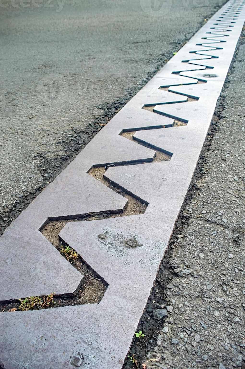 Bridge expansion joint close-up showing zigzag metal pattern