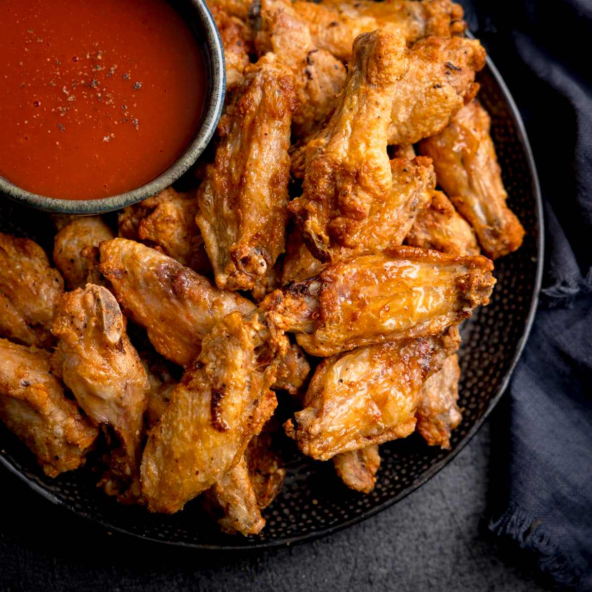Crispy air fryer chicken wings with buffalo sauce