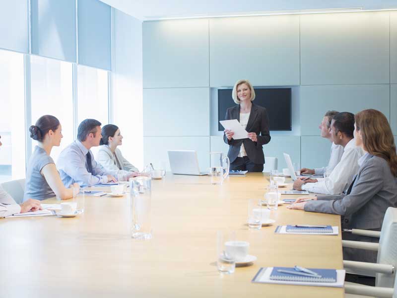 Diverse business team in a boardroom discussing investment and market entry strategy