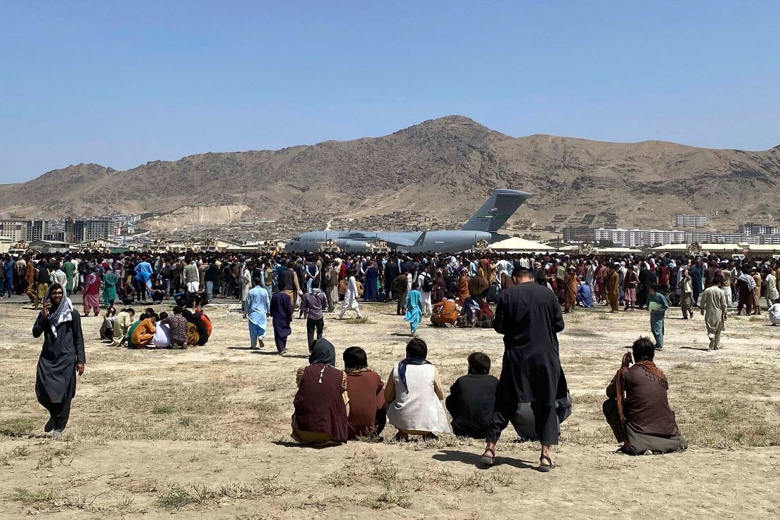 Crowd near aircraft during airport evacuation