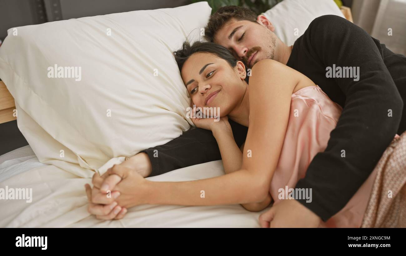cuddling positions for sleep — couple cuddling warmly in bed