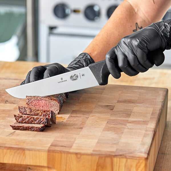 Victorinox Fibrox knife in use on cutting board