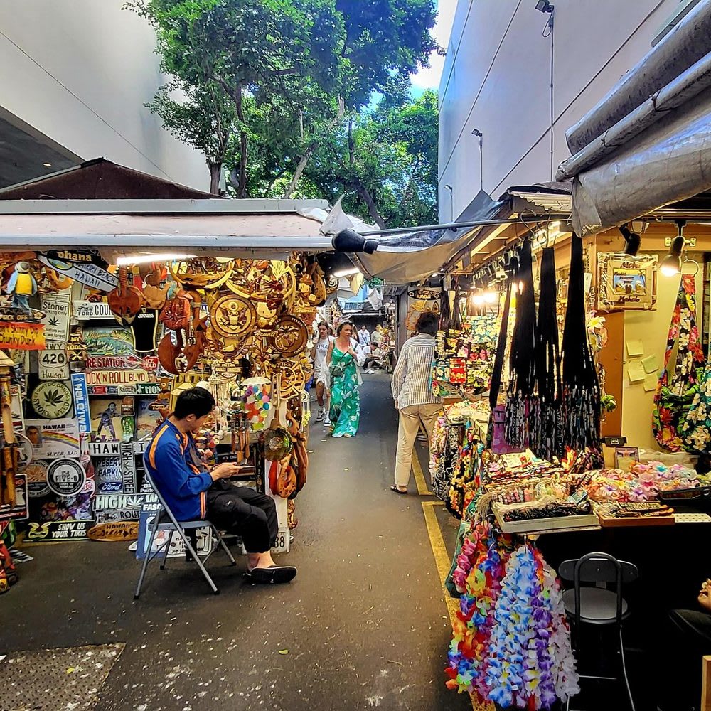 Kalakaua Avenue festival stalls with colorful awnings
