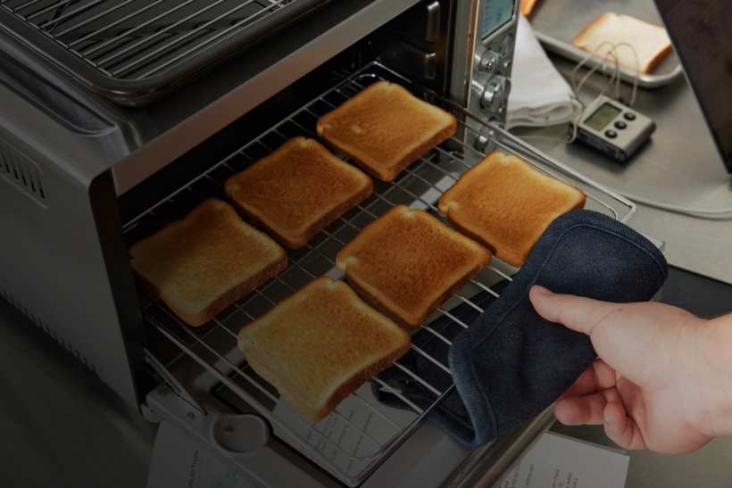 Toasted bread coming out of toaster oven
