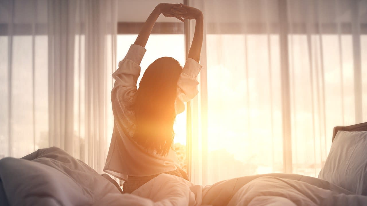 how many hours of sleep not enough — tired woman waking up unrefreshed