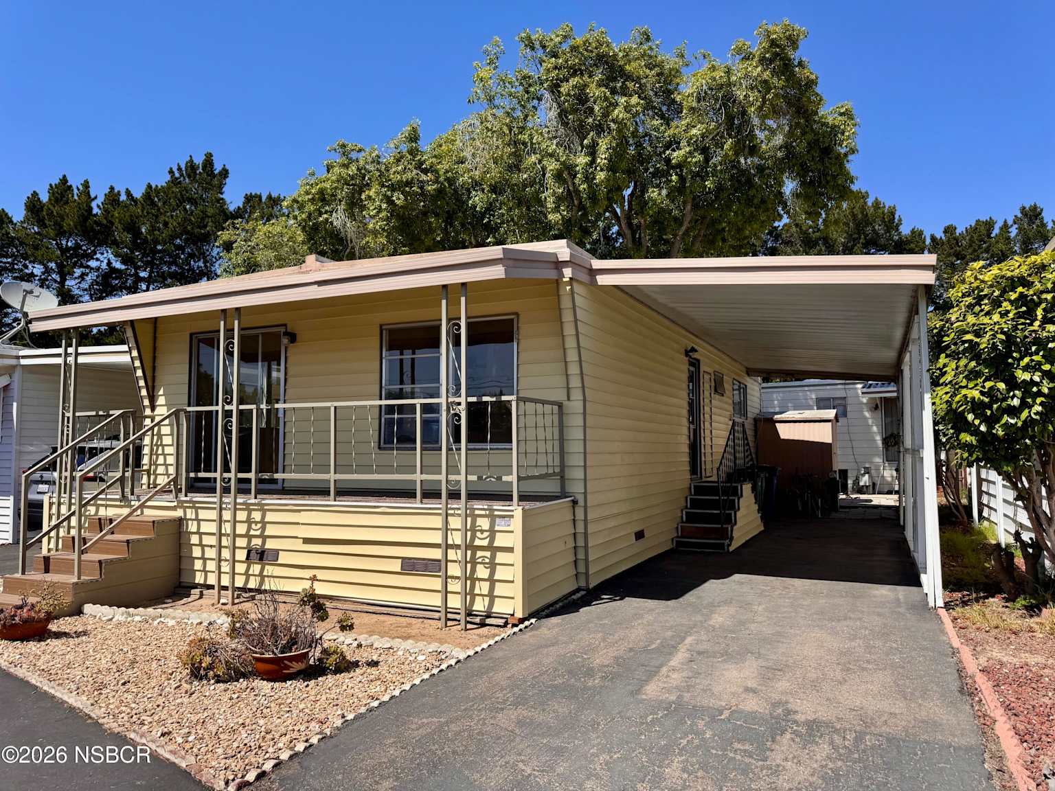 A single-story home in Orcutt with trees and a driveway.