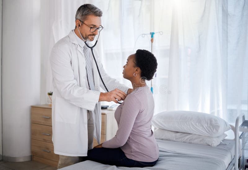 Doctor discussing heart care with patient in hospital