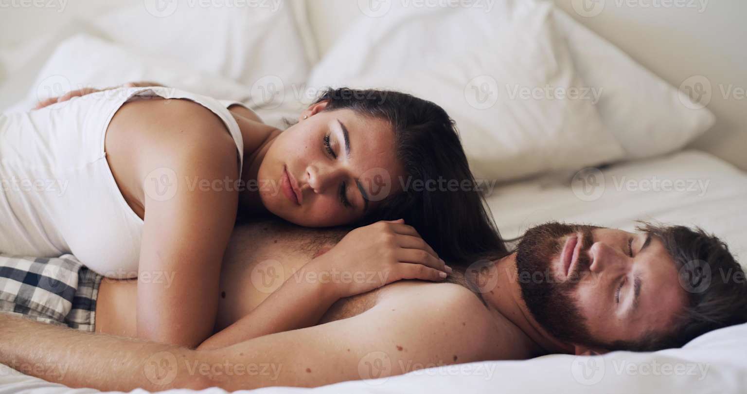 cuddling positions — couple leg hug sleeping cozy bedroom