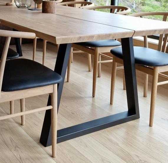 Light wood top black metal legs dining