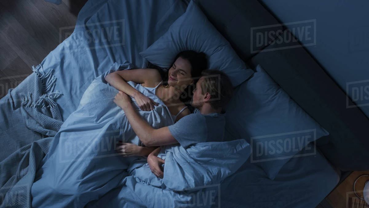cuddling positions — couple sleeping together minimal touch cozy bedroom